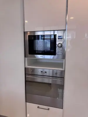 a stainless steel oven with a microwave in a kitchen at Central BKK Luxuxy Pool Villa 4BR in Bangkok