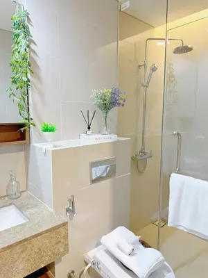 a bathroom with a shower and a sink at 2 Bed 2 Bath Phrom Phong BTS in Bangkok