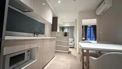 a kitchen with a living room and a dining room at Paradise condo-perfect location in Bangkok