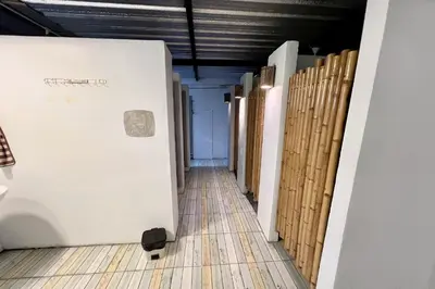 a hallway in a building with wooden walls at Orchid Hostel Near Bumrungrad hospital and Nana Market in Bangkok