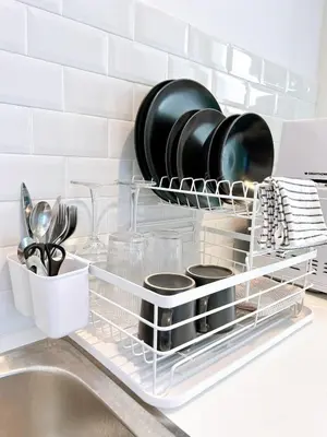 a dish drying rack over a sink in a kitchen at Wonderful Stay BTS Ratchayothin in Bangkok