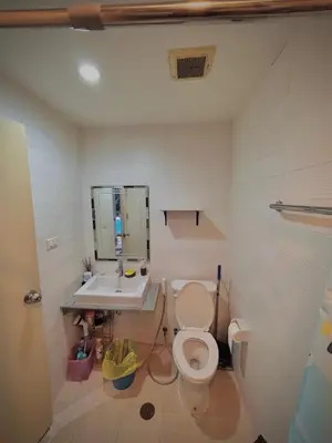 a bathroom with a toilet and a sink at Condo with Pool View & Great Amenities Bangkok in Sathani Ban Hua Mak