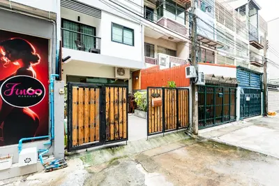 a building with a gate in front of a building at XX YON INN - Sukhumvit 4 BTS NANA in Bangkok
