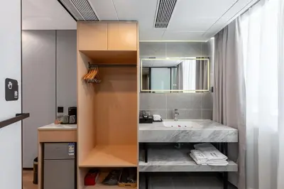 a bathroom with a sink and a mirror at Rama9 No1 Hotel in Bangkok