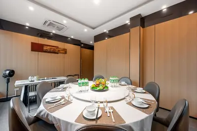 a dining room with a table and chairs at Rama9 No1 Hotel in Bangkok