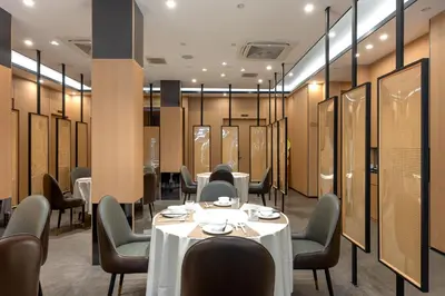 a dining room with a table and chairs at Rama9 No1 Hotel in Bangkok