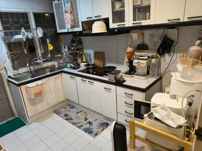 a small kitchen with a sink and a counter at Privacy House in Ban Bang Phai