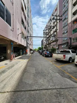 an empty street in a city with parked cars at new room near Don Mueang airport,Impact,BTS 339 in Ban Song Hong