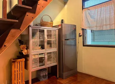 a kitchen with a refrigerator next to a staircase at Lamduan house whole House - 3BR - Experience temple and canal life in Bangkok