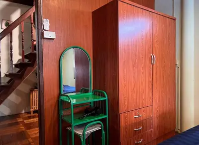 a room with a green shelf and a mirror at Lamduan house whole House - 3BR - Experience temple and canal life in Bangkok