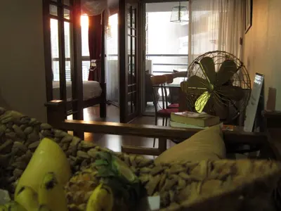a living room with a couch with bananas on it at 1br with Pool Gym near BTS Phrom Phong in Khlong Toei