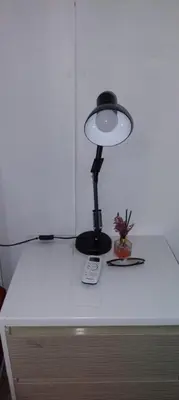 a lamp sitting on top of a white table at Double Room-C102 in Bangkok