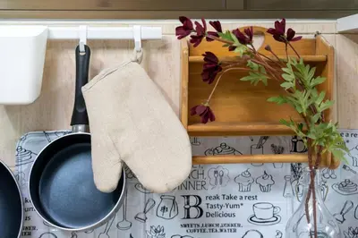 a towel hanging on a rack next to a pan at 110 House 4Bedroom in Ban Zong Katiam
