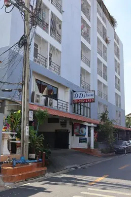 a building on the side of a street at DD House Apartment in Bangkok