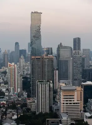 a view of a city with tall buildings at Bangrak HANGOVER 2 Central River Station in Bangkok