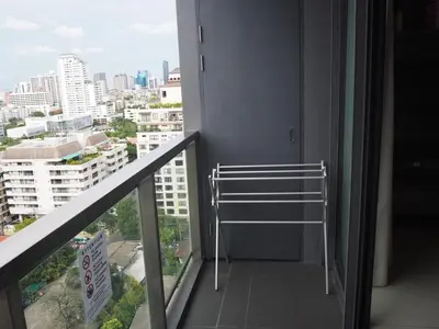 a room with a balcony with a view of a city at Circle Sukhumvit31 Bangkok #2BR #5ppl in Bangkok