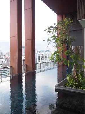 a building with a pool of water on the floor at Circle Sukhumvit31 Bangkok #2BR #5ppl in Bangkok