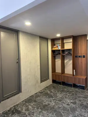 an empty room with glass doors and a walk in closet at Thai Loft \u6cf0\u95a3 in Bangkok