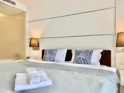 a bedroom with two beds with towels on them at Sathorn Prime Residence 1BR #Bangkok in Bangkok