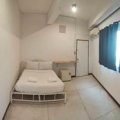 a small bedroom with a bed in a room at XX GO INN Asiatique BKK - โกอินน์ เอเชียทีค เจริญกรุง in Godown