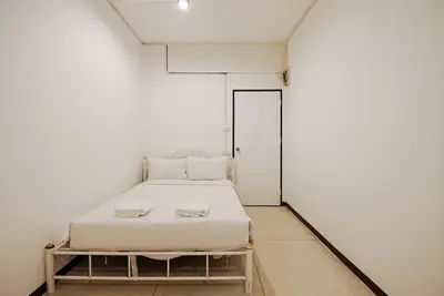 a small white room with a bed in it at xx GO INN Asiatique BKK - โกอินน์ เอเชียทีค เจริญกรุง in Godown