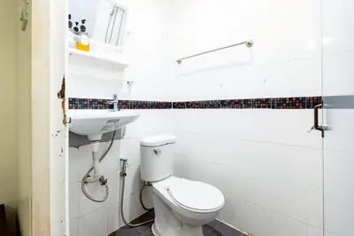 a bathroom with a toilet and a sink at XX Oh My Nap - BTS Nana โอ้ มาย แนป ซอยนานา in Bangkok