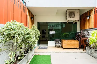 a patio with a table and chairs in a building at YON INN Sukhumvit 4 BTS Nana in Bangkok