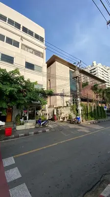 an empty street in a city with a building at YON INN Sukhumvit 4 BTS Nana in Bangkok