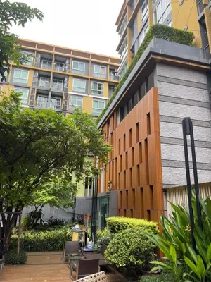 an apartment building with a courtyard in front of it at Welcome to warm room here have gym saona Netflix in Bangkok