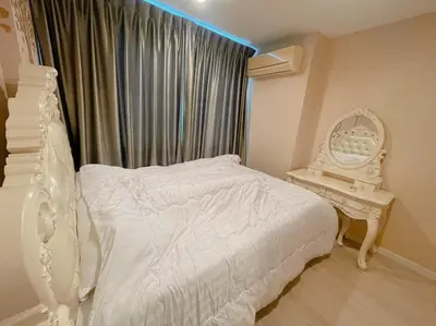a bedroom with a white bed and a mirror at Welcome to warm room here have gym saona Netflix in Bangkok