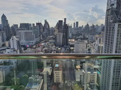 a view of a city from the top of a skyscraper at Kuma House Sukhumvit in Bangkok