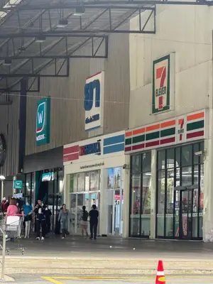 a store front with people standing outside of it at MoonStay C5 Impactarena-Donmuang-FreeSpeedWifi in Thung Si Kan