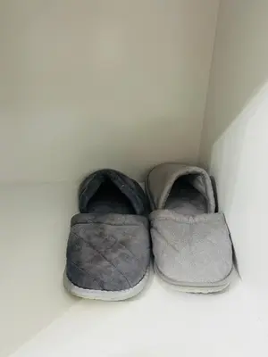 a pair of shoes sitting in the corner of a room at MoonStay C1 Impact Arena Muangthongthani-Donmuang-FreeSpeedWifi in Nonthaburi