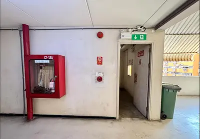 a gas station with a red dispenser on the wall at MoonStay C1 Impact Arena Muangthongthani-Donmuang-FreeSpeedWifi in Nonthaburi