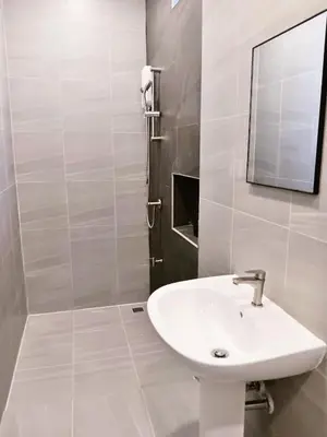 a white bathroom with a sink and a mirror at HD China Town MRT Dragon Temple กลางเยาวราช in Bangkok
