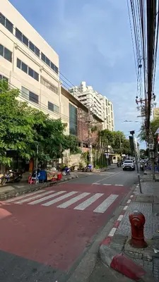 a red fire hydrant sitting on the side of a street at XX YON INN Sukhumvit 4 Bangkok - BTS Nana in Bang Kapi