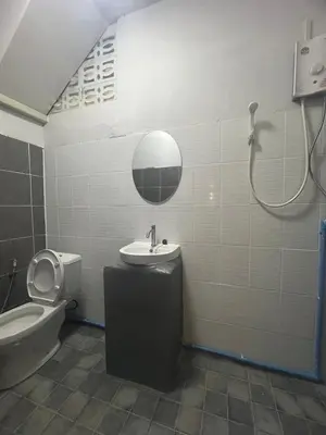 a bathroom with a sink and a toilet and a shower at Capricorn hostel Yaowarat in Chinatown