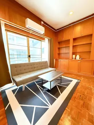 a living room with a couch and a table at xx Stay On Sukhumvit Soi 11 สเตย์ออน สุขุมวิท 11 in Makkasan