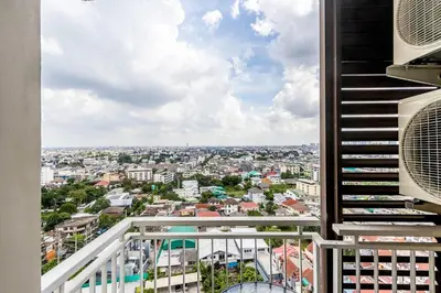 a balcony with a view of a city at TC Contel At True Digital Park in Amphoe Phra Khanong