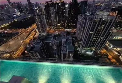 a view of a city from the top of a skyscraper at City Lights Retreat in Bangkok