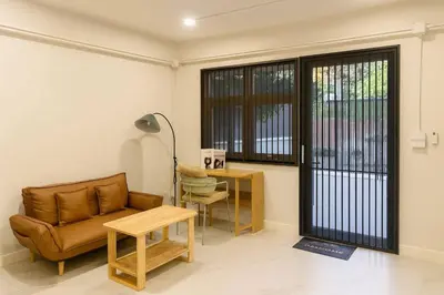a living room with a couch and a table at Lovely Townhome in Shopping District near BTS&MRT in Bang Su
