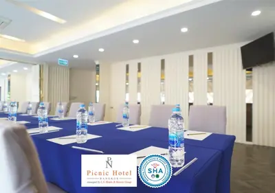 a conference room with a table with bottles of water on it at Picnic Hotel Bangkok - Rang Nam in Bangkok
