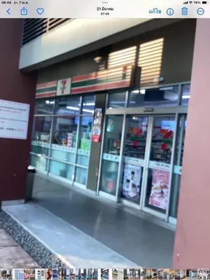 a store front with its doors open in a building at Lummpni palace in Ban Bang Toei (1)