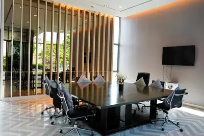 a conference room with a black table and chairs at Luxury room close to BTS in Bangkok
