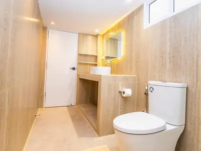 a bathroom with a white toilet and a sink at 2 Bedroom for 3 guests in heart Sathorn with Balcony in Bangkok