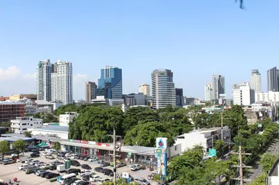 a cityscape of a city with a parking lot at Bangkok Place Apartment - EKAMAI BTS in Bangkok