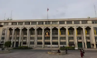 a large building with a clock on the front of it at xxThe Hidden Giant Swing เดอะ ฮิดเด้น เสาชิงช้า in Bangkok