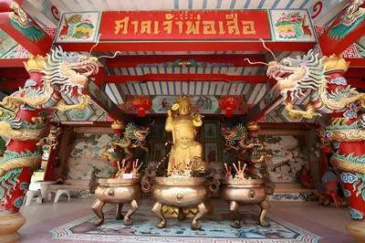 a temple with a statue in the center of a room at xxThe Hidden Giant Swing เดอะ ฮิดเด้น เสาชิงช้า in Bangkok