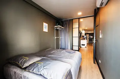 a bedroom with a large bed in a room at NEW Bangkok centre-2 bedrooms Netflix 31 floor in Bangkok