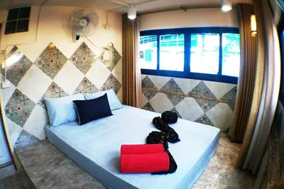 a bedroom with a teddy bear sitting on a bed at SKY 6 The Perfect Quiet Oasis BKK Center Near MRT in Bangkok